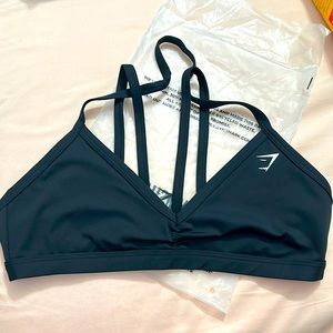 Brand new. Size medium. Gymshark minimal sports bra. Removable back straps.